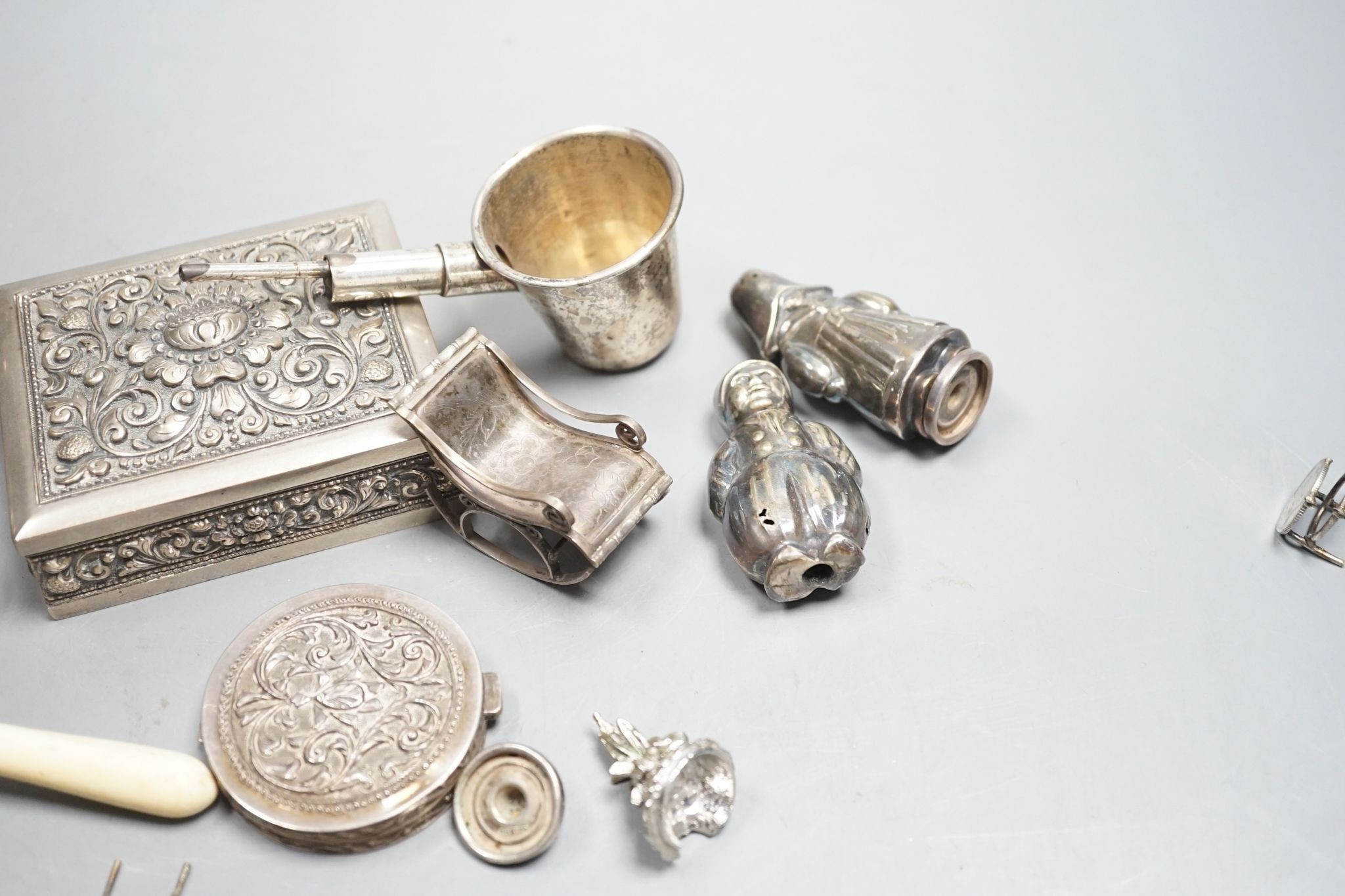 A group of small continental white metal items including a 800 compact, coin mounted miniature furniture, cigarette box, plated lamp lighter, etc.